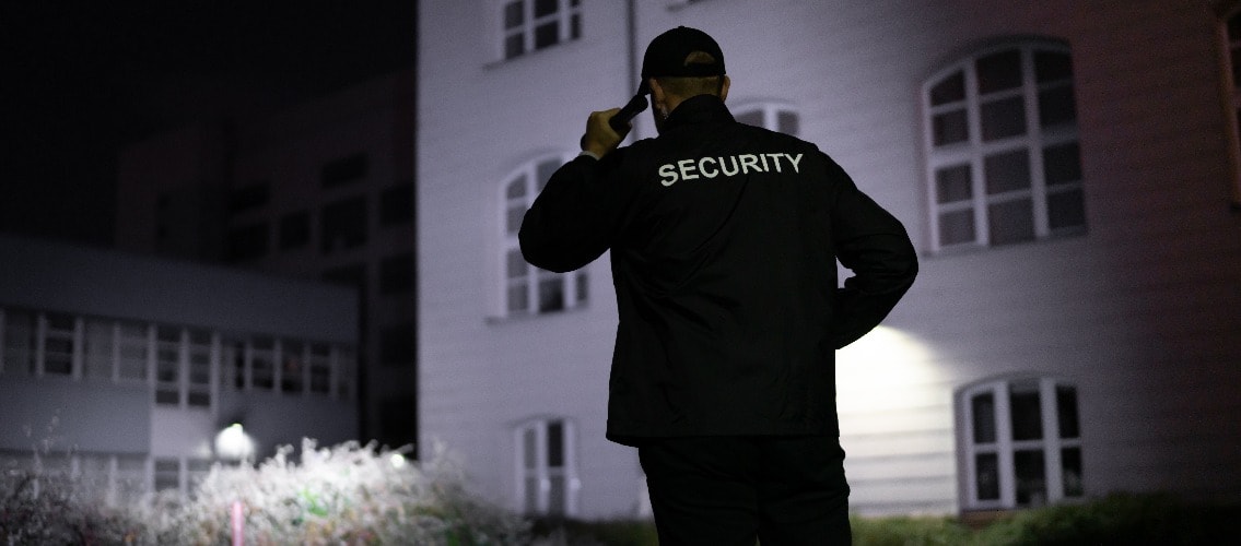 Security Guard Walking Building Perimeter