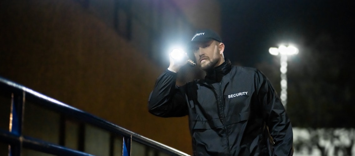 Security Guard Walking Building Perimeter